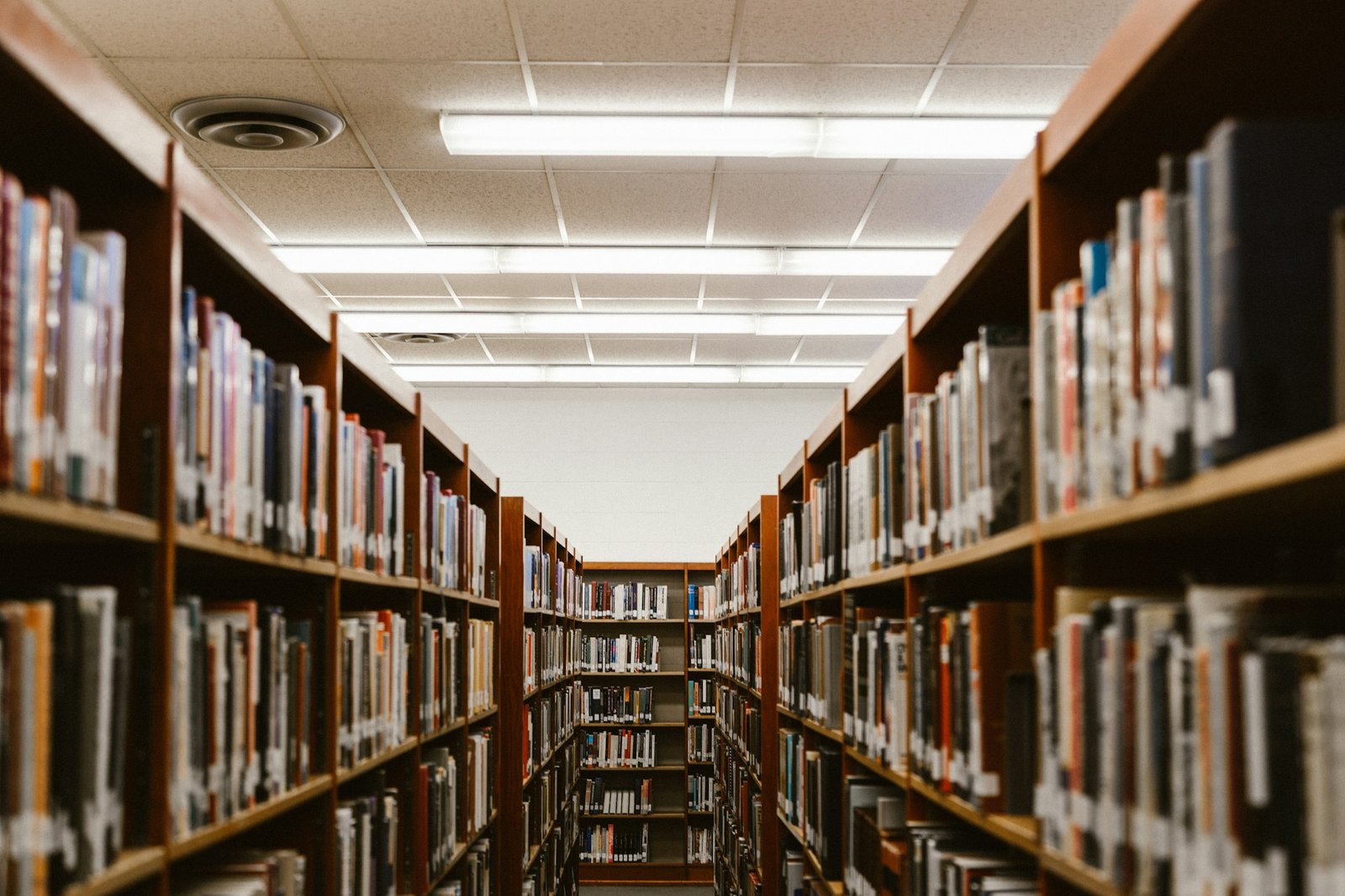 Library aisle with tall bookshelves